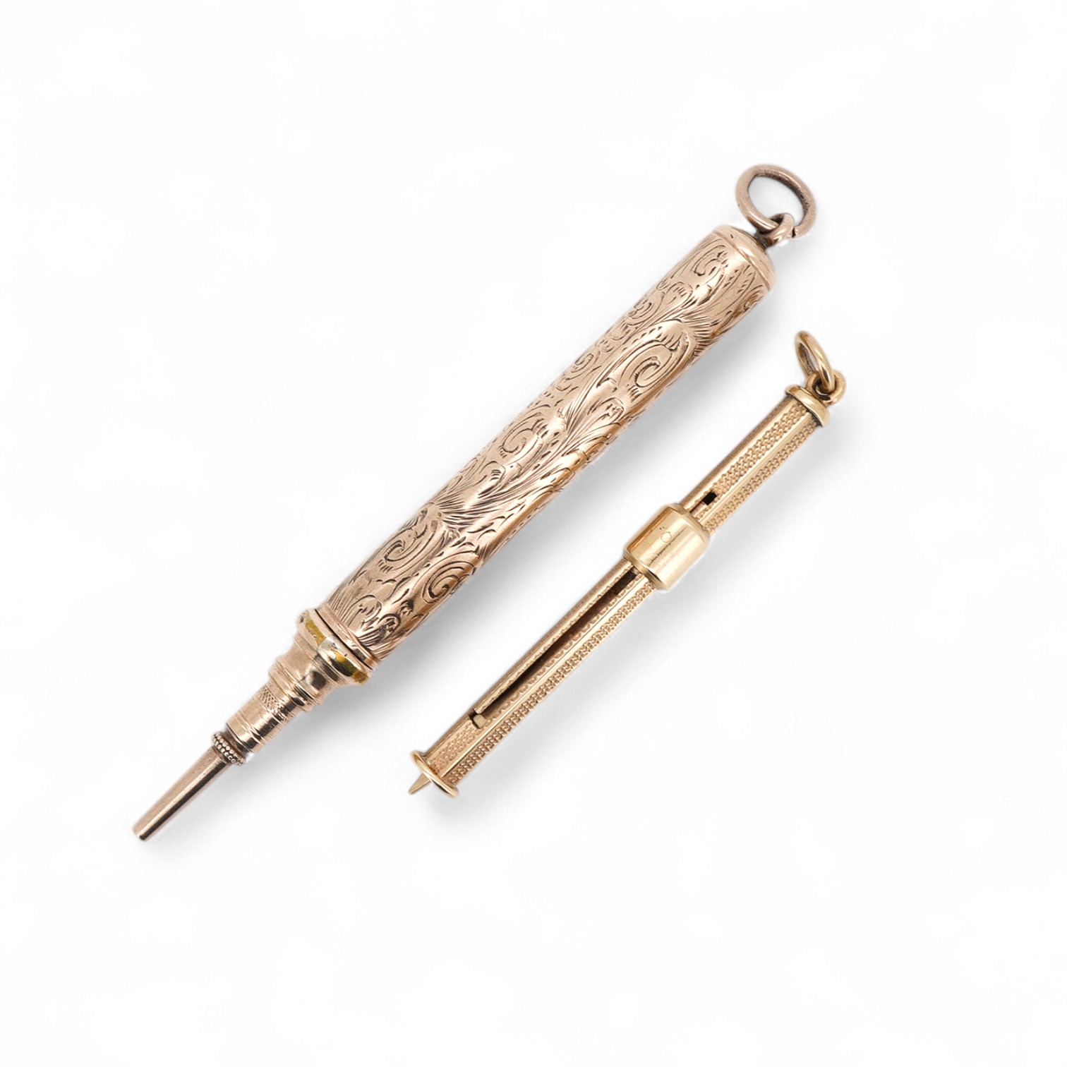 A 9ct gold propelling toothpick, 50mm and a yellow metal propelling pencil.